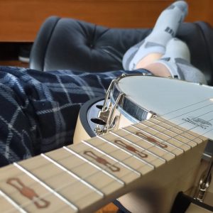 Guitar, ukulele, and banjo are instruments you can learn while chilling.